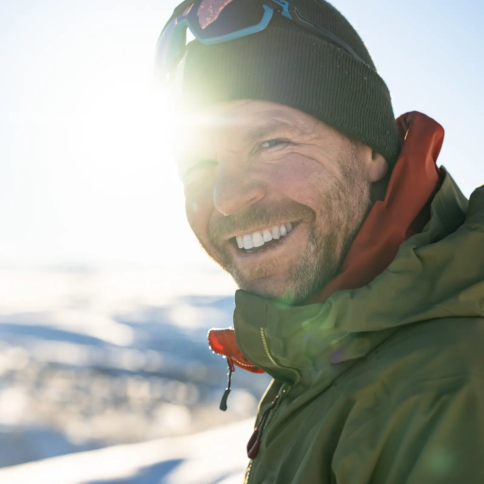 Smiling skier in winter sun from Tyin Filefjell