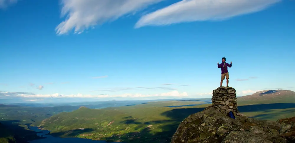 Hiker at the top of Uksestigen in Vang